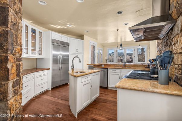Interior, Kitchen, Pendant Lights, Recessed Lighting, Stainless Steel Appliances, Stone Walls, Wood Texture Flooring