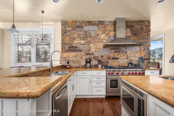 Interior, Kitchen, Pendant Lights, Recessed Lighting, Stainless Steel Appliances, Stone Walls, Wood Texture Flooring