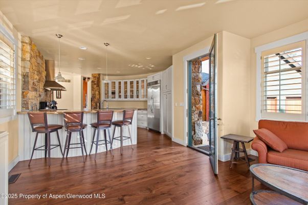 Interior, Kitchen, Pendant Lights, Recessed Lighting, Stainless Steel Appliances, Stone Walls, Wood Texture Flooring