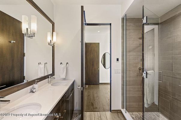 Bathroom, Dual Sink Vanities, Glass Shower, Interior, Wood Texture Flooring