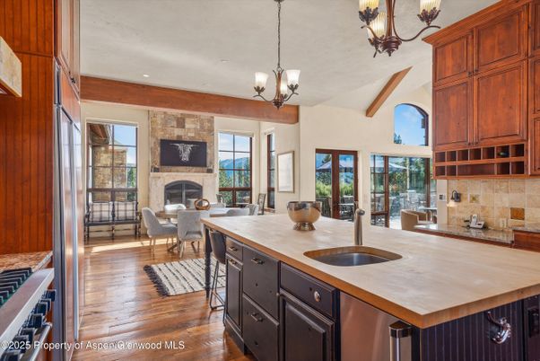 Chandelier, Dining room, Fireplace, Interior, Kitchen, Living room, Recessed Lighting, Stone Walls, Wooden Beams, Wood Texture Flooring