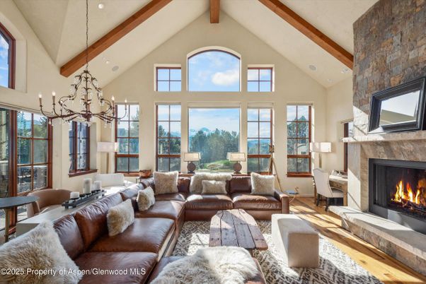 Chandelier, Fireplace, Interior, Living room, Recessed Lighting, Stone Walls, Wooden Beams, Wood Texture Flooring