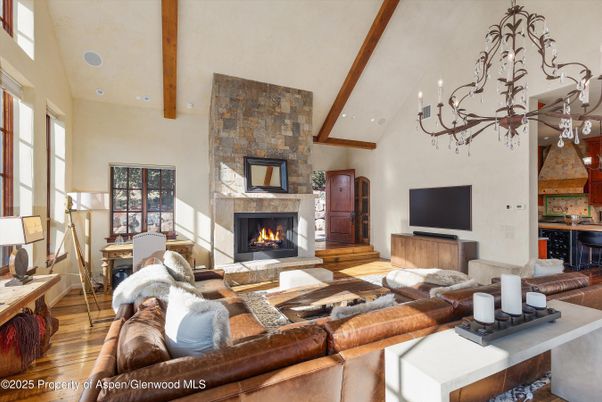 Chandelier, Fireplace, Interior, Living room, Recessed Lighting, Stone Walls, Wooden Beams, Wood Texture Flooring