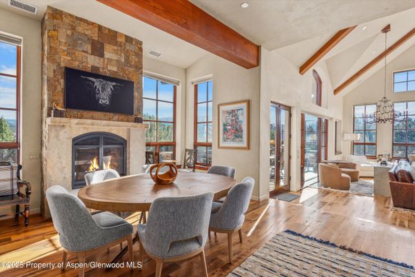 Dining room, Fireplace, Interior, Living room, Pendant Lights, Recessed Lighting, Stone Walls, Wooden Beams, Wood Texture Flooring