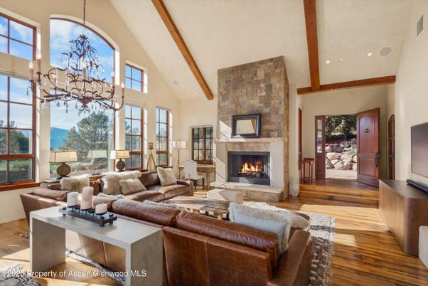 Chandelier, Fireplace, Interior, Living room, Recessed Lighting, Stone Walls, Wooden Beams, Wood Texture Flooring