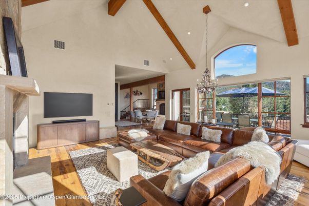 Chandelier, Dining room, Fireplace, Interior, Living room, Pendant Lights, Recessed Lighting, Wooden Beams, Wood Texture Flooring