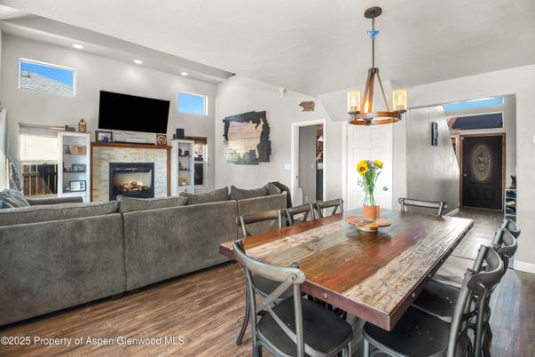 Dining room, Fireplace, Interior, Living room, Pendant Lights, Recessed Lighting, Wood Texture Flooring