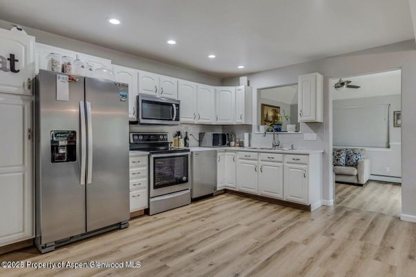 Interior, Kitchen, Recessed Lighting, Stainless Steel Appliances, Wood Texture Flooring