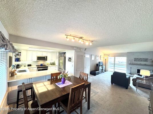 Dining room, Fireplace, Interior, Kitchen, Living room, Stainless Steel Appliances, Stone Walls