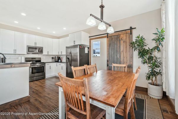 Dining room, Interior, Kitchen, Pendant Lights, Recessed Lighting, Stainless Steel Appliances, Wood Texture Flooring