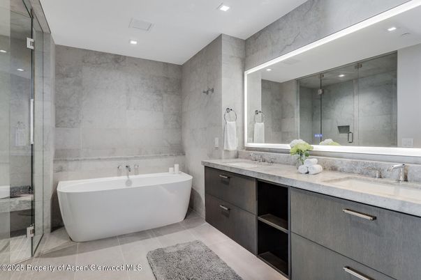 Bathroom, Dual Sink Vanities, Free Standing Baths, Glass Shower, Interior, Marble Walls, Recessed Lighting