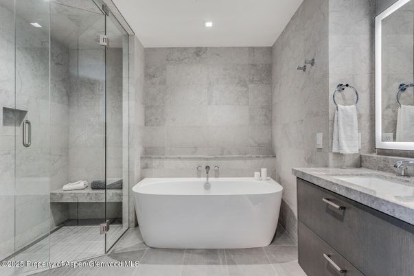 Bathroom, Free Standing Baths, Glass Shower, Interior, Marble Walls, Recessed Lighting