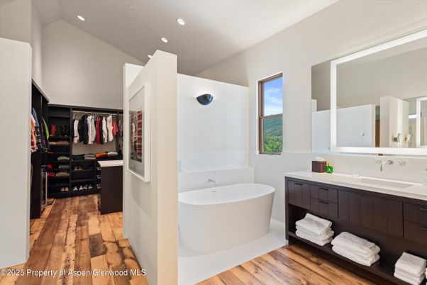 Bathroom, Dual Sink Vanities, Free Standing Baths, Interior, Recessed Lighting, Walk-in Closets, Wood Texture Flooring