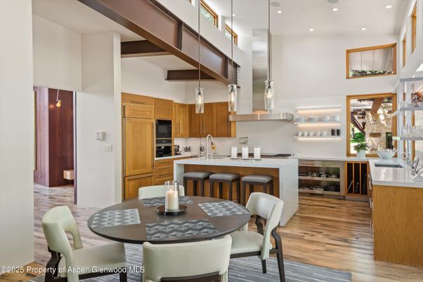 Dining room, Interior, Kitchen, Pendant Lights, Recessed Lighting, Stainless Steel Appliances, Wood Texture Flooring