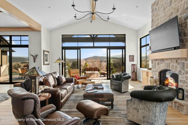 Fireplace, Interior, Living room, Recessed Lighting, Stone Walls, Wood Texture Flooring