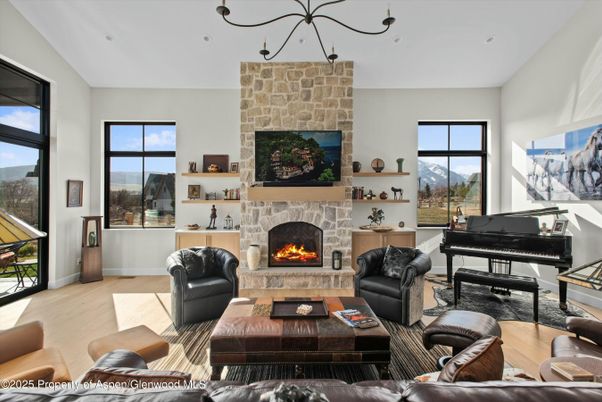 Fireplace, Interior, Living room, Piano, Recessed Lighting, Stone Walls, Wood Texture Flooring