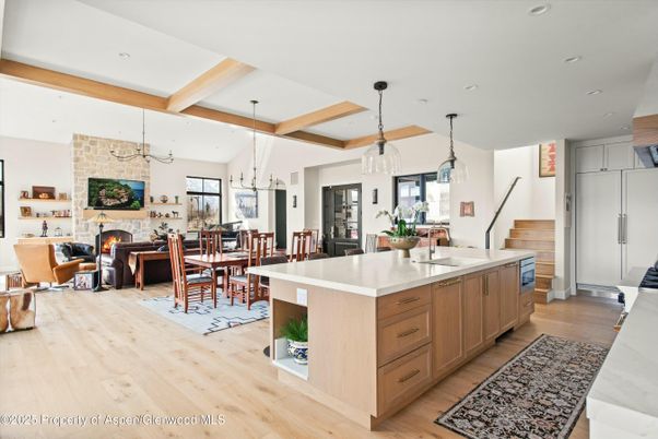 Dining room, Fireplace, Interior, Kitchen, Living room, Pendant Lights, Recessed Lighting, Stone Walls, Wooden Beams, Wood Texture Flooring