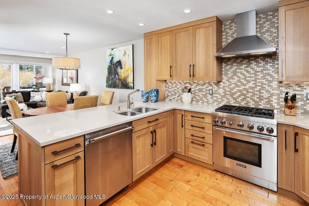 Dining room, Interior, Kitchen, Living room, Pendant Lights, Recessed Lighting, Stainless Steel Appliances, Wood Texture Flooring