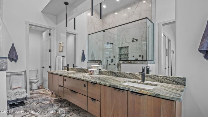 Bathroom, Dual Sink Vanities, Glass Shower, Interior, Marble Walls, Pendant Lights, Recessed Lighting