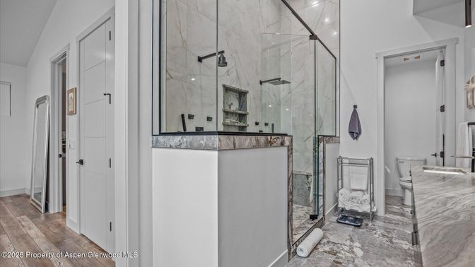 Bathroom, Glass Shower, Interior, Marble Walls, Wood Texture Flooring
