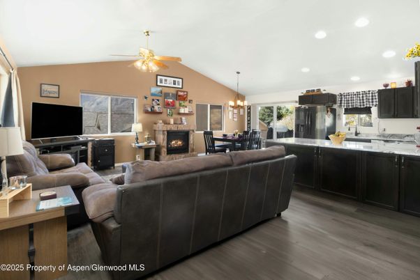 Chandelier, Dining room, Fireplace, Interior, Kitchen, Living room, Pendant Lights, Recessed Lighting, Wood Texture Flooring