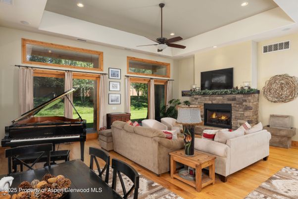 Fireplace, Interior, Living room, Piano, Recessed Lighting, Wood Texture Flooring