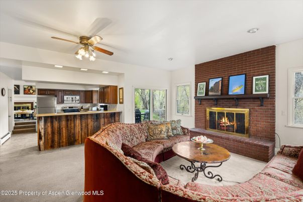 Fireplace, Interior, Kitchen, Living room, Recessed Lighting, Stainless Steel Appliances, Stone Walls