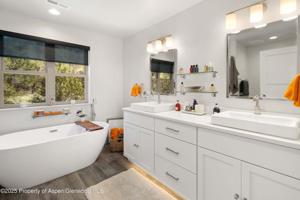 Bathroom, Dual Sink Vanities, Free Standing Baths, Interior, Recessed Lighting, Wood Texture Flooring