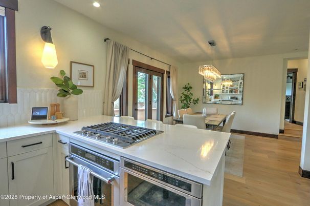 Chandelier, Dining room, Interior, Kitchen, Recessed Lighting, Stainless Steel Appliances, Wood Texture Flooring