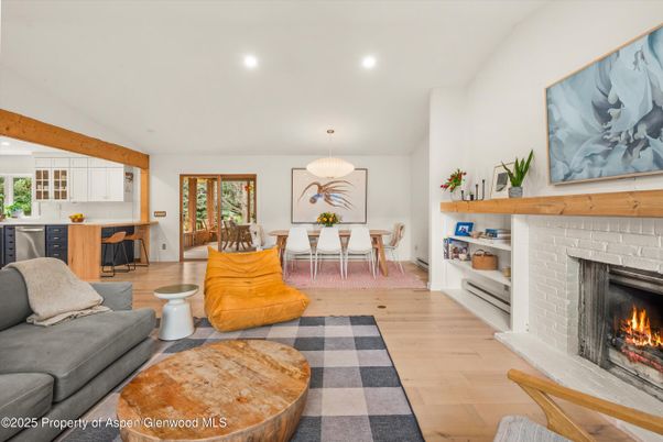Dining room, Fireplace, Interior, Living room, Pendant Lights, Recessed Lighting, Wood Texture Flooring