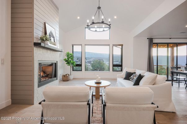 Dining room, Fireplace, Interior, Living room, Pendant Lights, Recessed Lighting, Water, Wood Texture Flooring