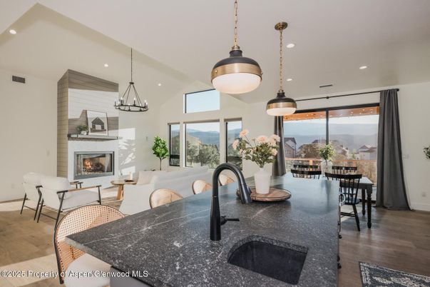 Dining room, Fireplace, Interior, Living room, Pendant Lights, Recessed Lighting, Wood Texture Flooring