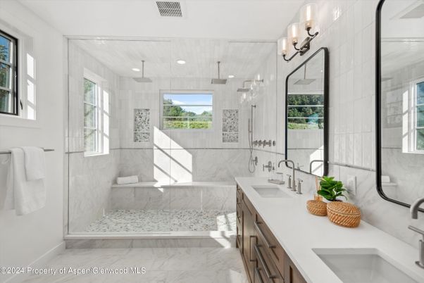 Bathroom, Dual Sink Vanities, Glass Shower, Interior, Marble, Marble Walls, Recessed Lighting
