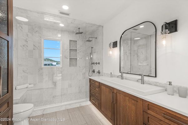 Bathroom, Dual Sink Vanities, Glass Shower, Interior, Marble Walls, Recessed Lighting