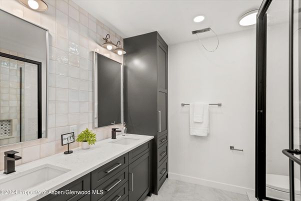 Bathroom, Dual Sink Vanities, Glass Shower, Interior, Marble, Recessed Lighting