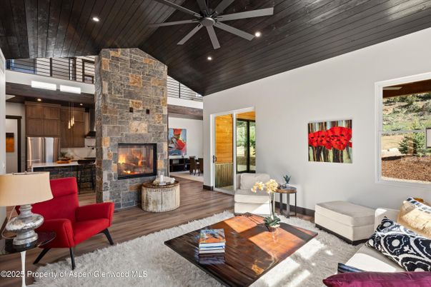 Fireplace, Interior, Kitchen, Living room, Recessed Lighting, Stainless Steel Appliances, Stone Walls, Wooden Ceilings, Wood Texture Flooring