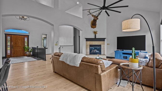 Chandelier, Fireplace, Interior, Living room, Pendant Lights, Recessed Lighting, Wood Texture Flooring