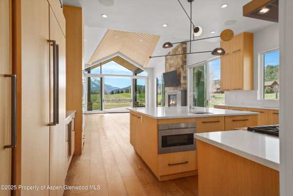 Fireplace, Interior, Kitchen, Pendant Lights, Recessed Lighting, Wood Texture Flooring