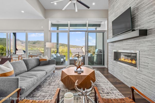 Fireplace, Interior, Living room, Recessed Lighting, Stone Walls, Wood Texture Flooring
