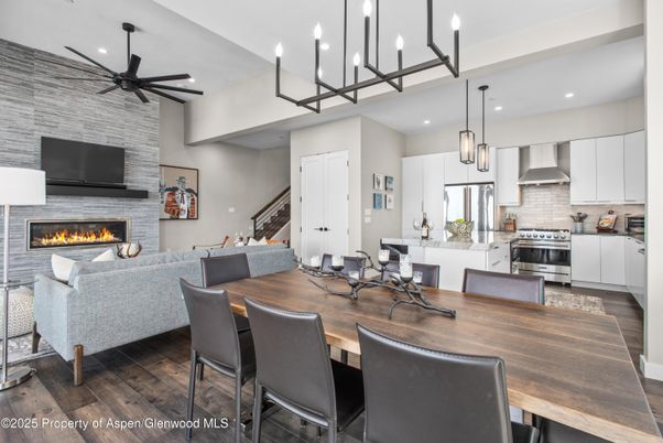 Dining room, Fireplace, Interior, Kitchen, Living room, Pendant Lights, Recessed Lighting, Stainless Steel Appliances, Stone Walls, Wood Texture Flooring