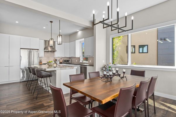 Chandelier, Dining room, Interior, Kitchen, Pendant Lights, Recessed Lighting, Stainless Steel Appliances, Wood Texture Flooring