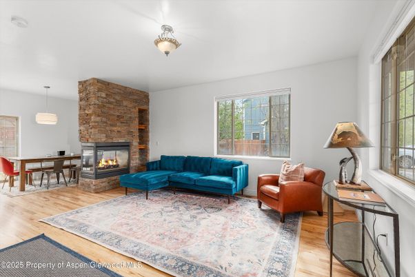 Dining room, Fireplace, Interior, Living room, Pendant Lights, Stone Walls, Wood Texture Flooring