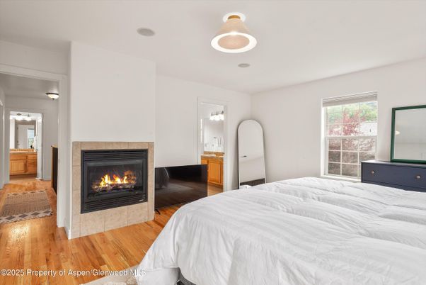 Bedroom, Fireplace, Interior, Pendant Lights, Wood Texture Flooring
