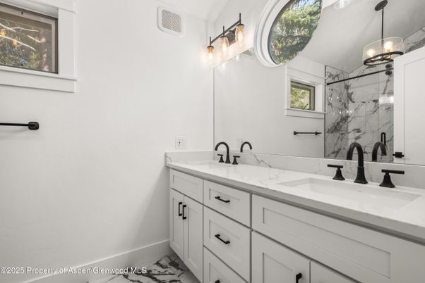 Bathroom, Dual Sink Vanities, Interior, Marble, Marble Walls, Pendant Lights