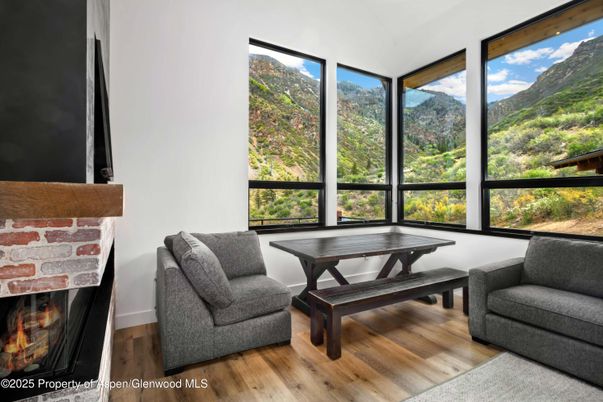 Fireplace, Interior, Sun Room, Wood Texture Flooring