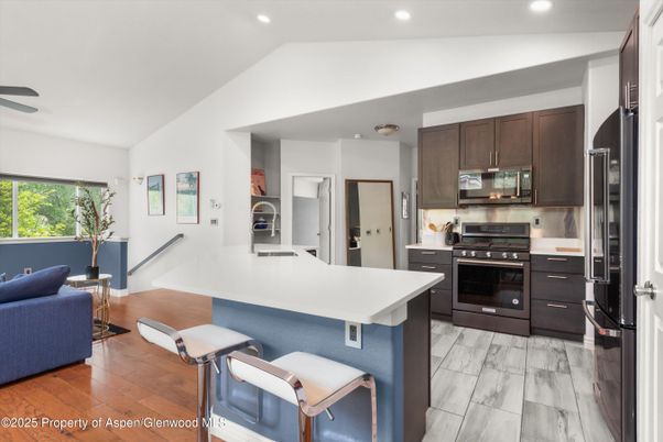 Interior, Kitchen, Recessed Lighting, Stainless Steel Appliances, Wood Texture Flooring