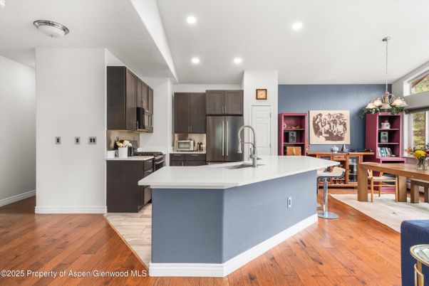 Chandelier, Dining room, Interior, Kitchen, Pendant Lights, Recessed Lighting, Stainless Steel Appliances, Wood Texture Flooring
