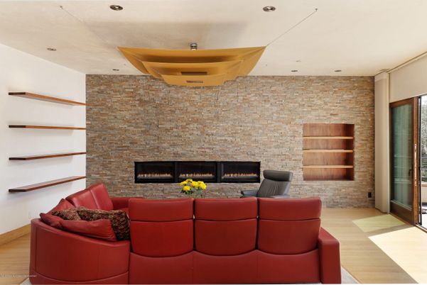 Fireplace, Interior, Living room, Recessed Lighting, Stone Walls, Wood Texture Flooring