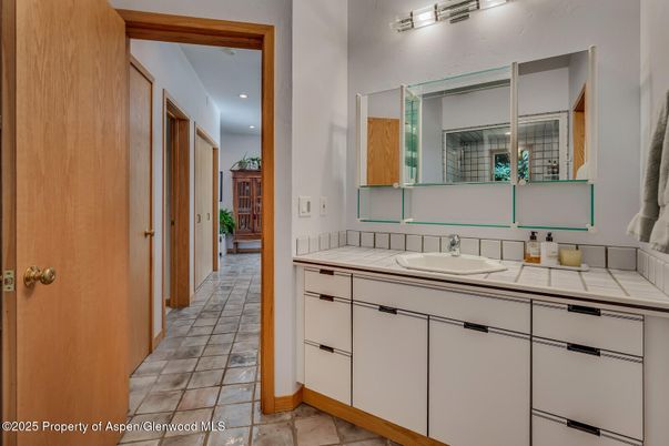Bathroom, Dual Sink Vanities, Interior, Recessed Lighting, Tile Countertops