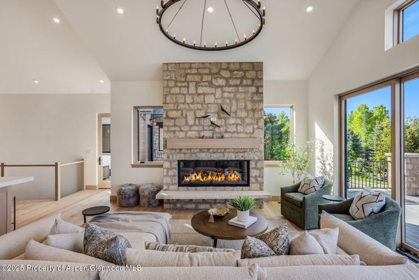 Fireplace, Interior, Living room, Recessed Lighting, Stone Walls, Wood Texture Flooring
